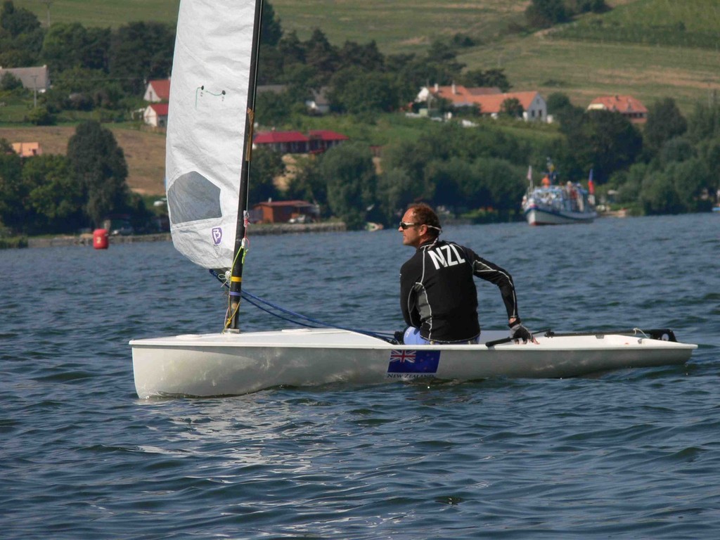 NZL 110 Andy Greager being followed by the spectator boat - Europe Dinghy Veteran World Cup 2011 © Andy Greager